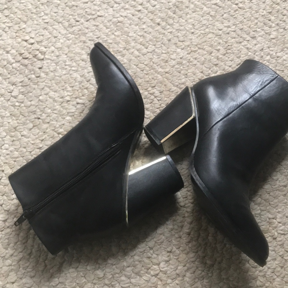 Aldo Black leather bootie with gold heel accent
